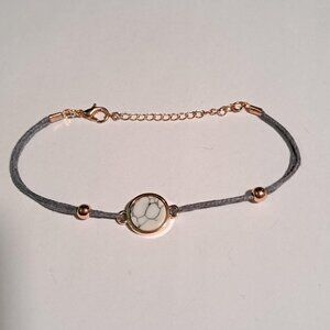 marble design and grey bracelet